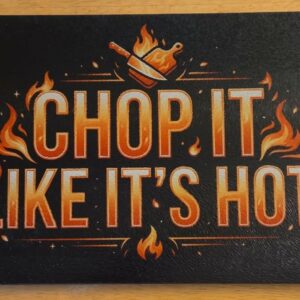 Black tempered glass cutting board with orange flames and Chop It Like It’s Hot kitchen design