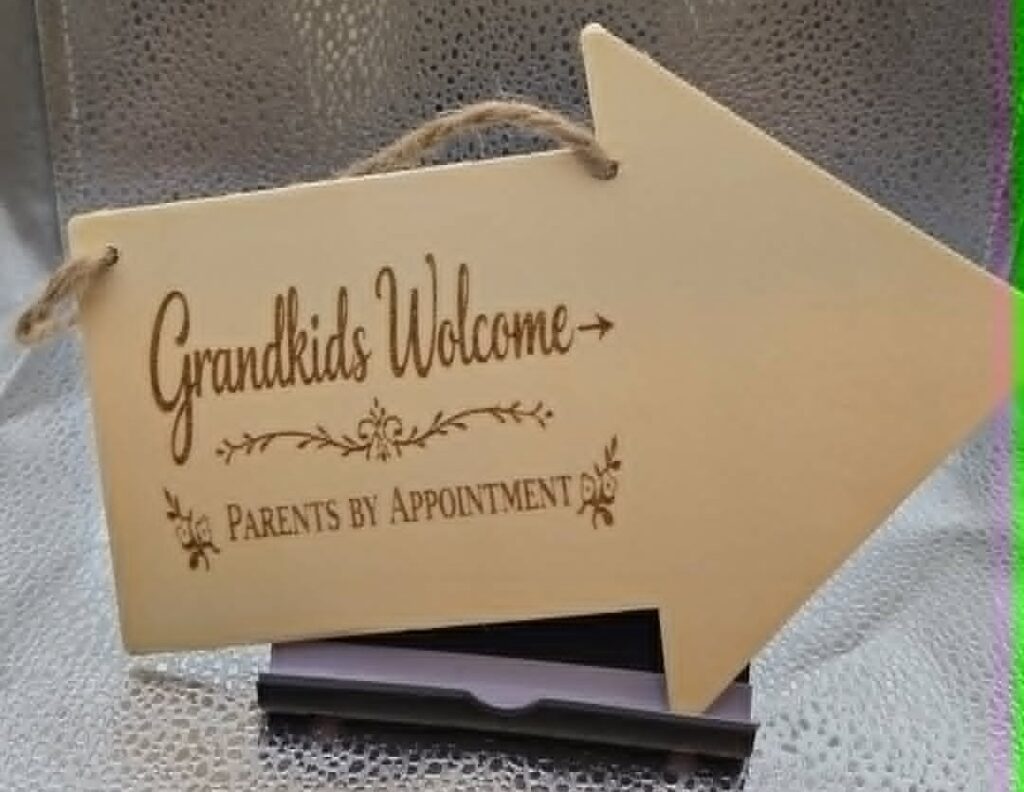 Engraved wooden arrow sign reading Grandkids Welcome, Parents by Appointment