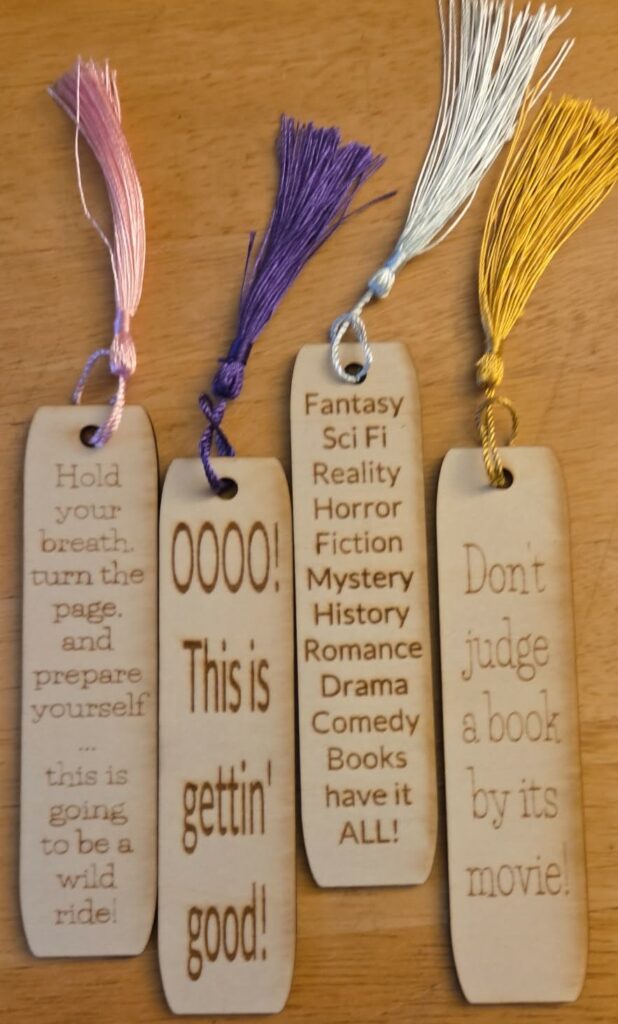 Set of engraved wooden bookmarks with tassels and book-themed sayings